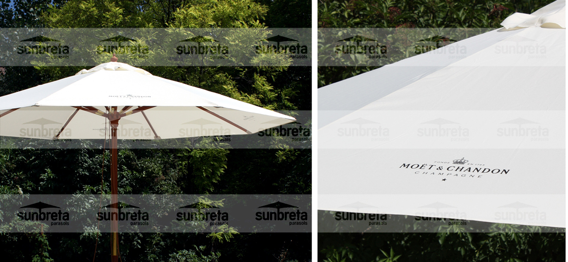 Aplicación de logotipo oscuro sobre lona blanca de parasol
